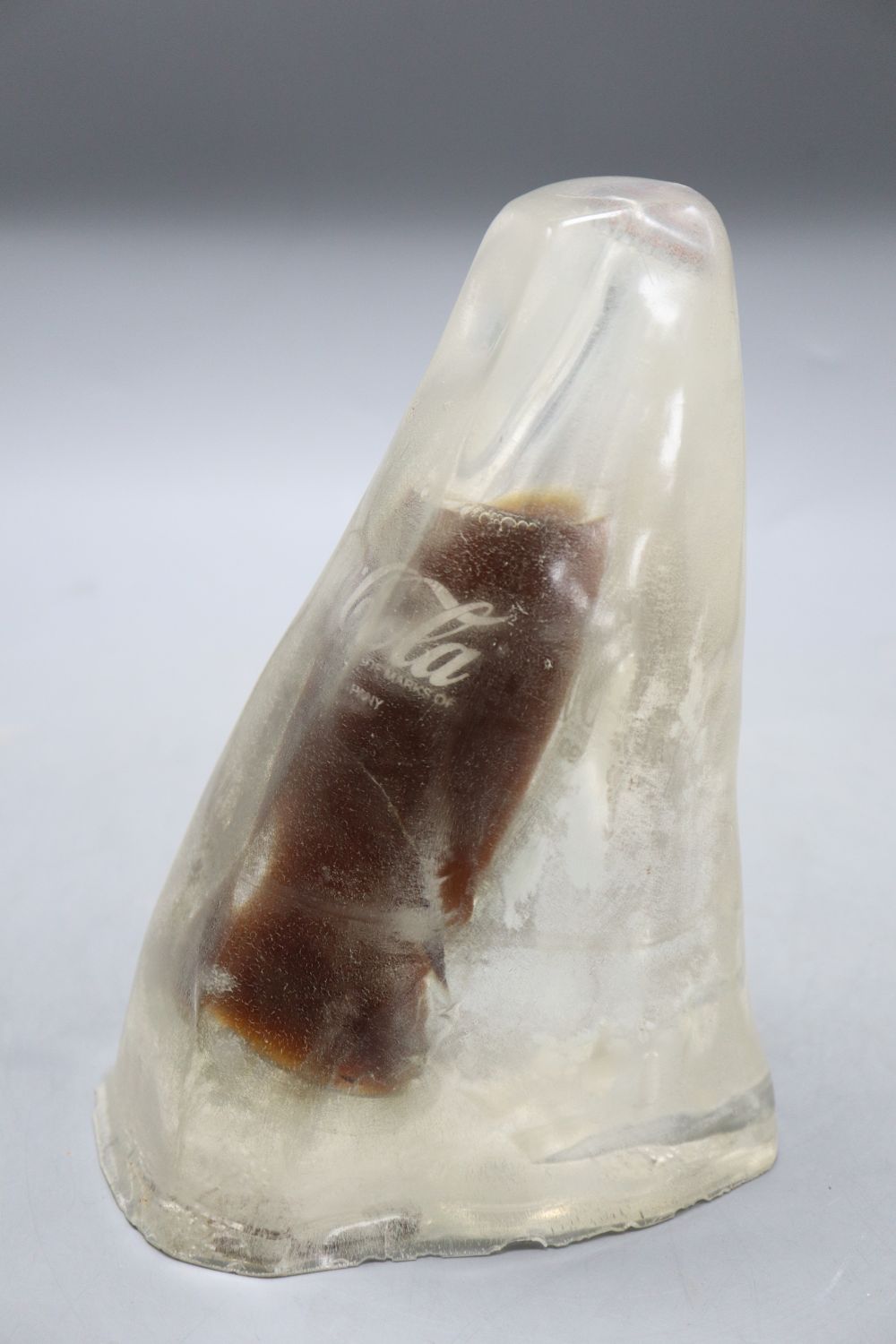 A novelty Coke bottle in ice, height 21cm